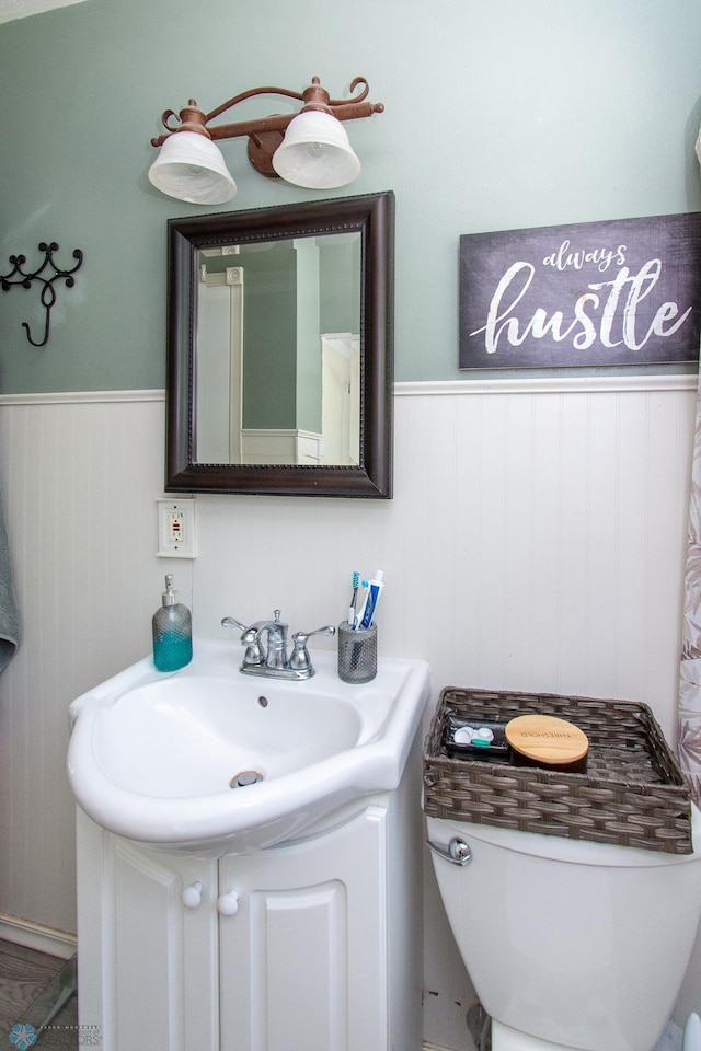 419 18th St S, Moorhead, MN 56560 - bathroom featuring wainscoting and vanity