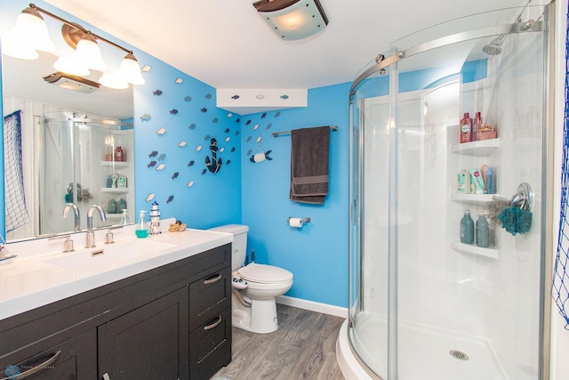 419 18th St S, Moorhead, MN 56560 - bathroom with wood finished floors, a stall shower, and vanity