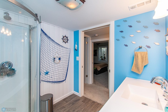 419 18th St S, Moorhead, MN 56560 - bathroom featuring a shower stall and wood finished floors