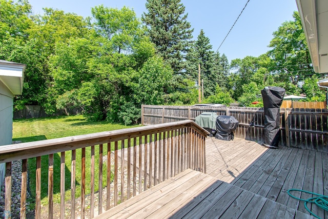 419 18th St S, Moorhead, MN 56560 - wooden terrace with a fenced backyard and view of wooded area