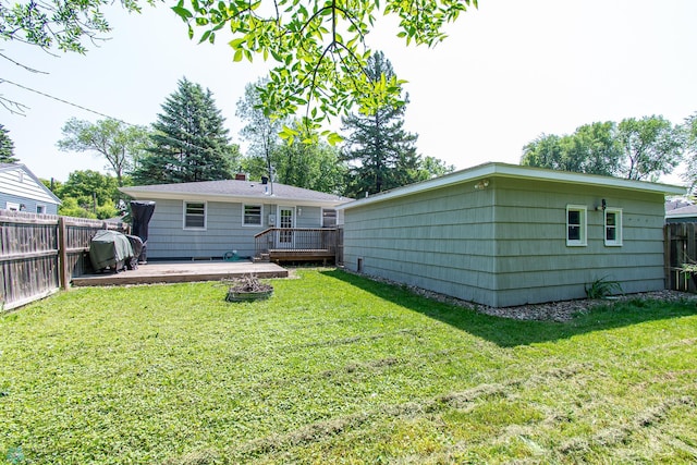419 18th St S, Moorhead, MN 56560 - rear view of house featuring a fenced backyard and a wooden deck