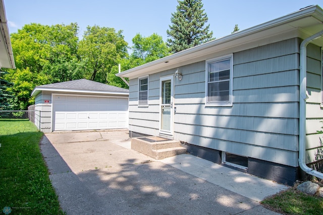 419 18th St S, Moorhead, MN 56560 - exterior space with a detached garage