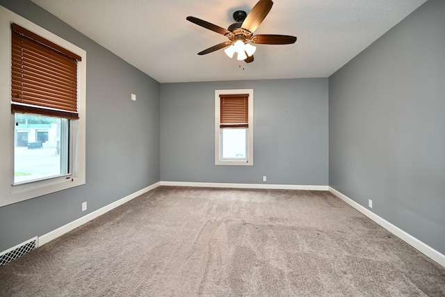579 4th St, Winona, MN 55987 - carpeted spare room featuring ceiling fan and baseboards