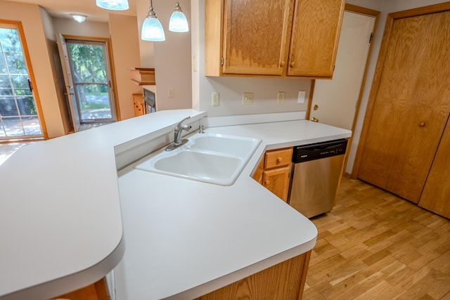 1865 Donegal Dr Unit 3, Woodbury, MN 55125 - kitchen with dishwasher, light wood finished floors, light countertops, hanging light fixtures, and a peninsula