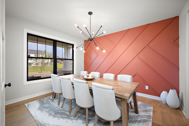 4805 Comstock Ln N, Plymouth, MN 55446 - dining space with a chandelier and light wood-style flooring