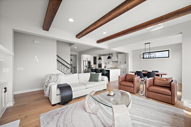 4805 Comstock Ln N, Plymouth, MN 55446 - living area featuring stairway, beamed ceiling, recessed lighting, and light wood-style flooring