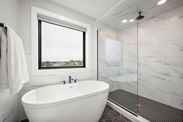 4805 Comstock Ln N, Plymouth, MN 55446 - bathroom featuring a soaking tub, a marble finish shower, tile walls, and recessed lighting