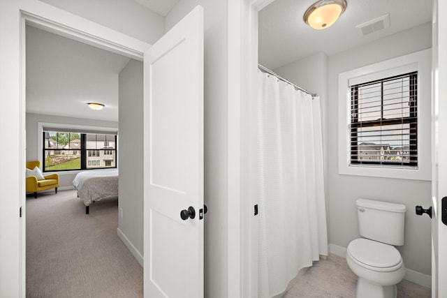 4805 Comstock Ln N, Plymouth, MN 55446 - ensuite bathroom featuring toilet and a shower with curtain