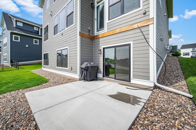4805 Comstock Ln N, Plymouth, MN 55446 - back of property with a patio area and a lawn