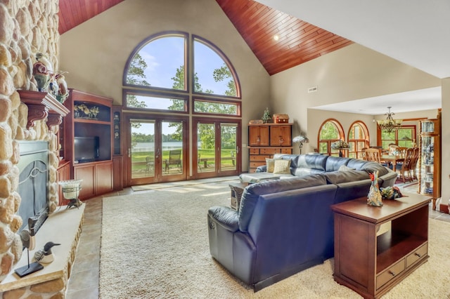 53245 Sunrise Ln, Park Rapids, MN 56470 - living area with high vaulted ceiling, a fireplace, wood ceiling, and a chandelier
