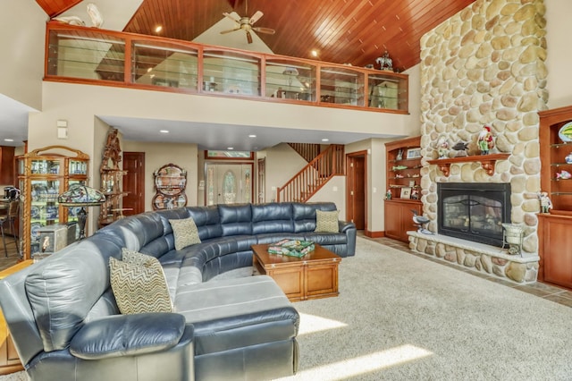 53245 Sunrise Ln, Park Rapids, MN 56470 - carpeted living room featuring high vaulted ceiling, recessed lighting, a fireplace, stairway, and wood ceiling