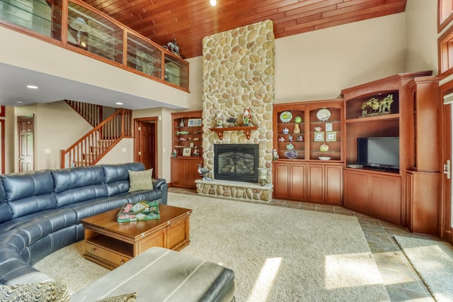 53245 Sunrise Ln, Park Rapids, MN 56470 - living room featuring a towering ceiling, wooden ceiling, recessed lighting, stairway, and a stone fireplace