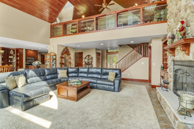 53245 Sunrise Ln, Park Rapids, MN 56470 - tiled living room with stairway, wooden ceiling, high vaulted ceiling, a stone fireplace, and recessed lighting