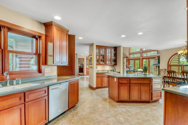 53245 Sunrise Ln, Park Rapids, MN 56470 - kitchen with stainless steel dishwasher, recessed lighting, brown cabinetry, glass insert cabinets, and a center island