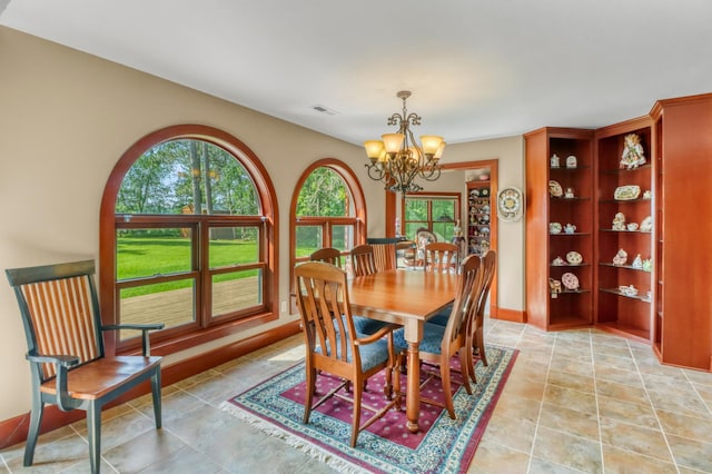 53245 Sunrise Ln, Park Rapids, MN 56470 - dining space with a chandelier and baseboards