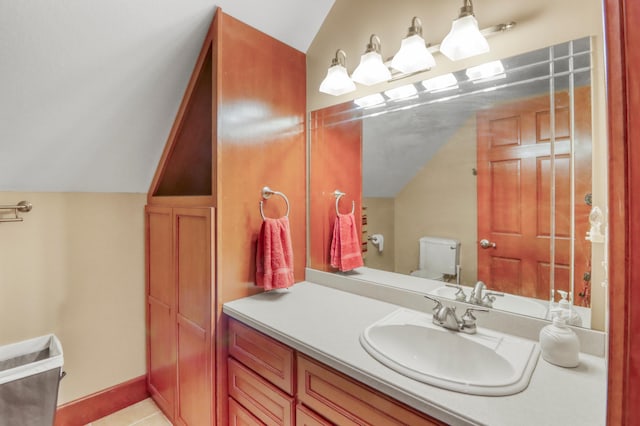 53245 Sunrise Ln, Park Rapids, MN 56470 - bathroom with vaulted ceiling, vanity, and tile patterned floors