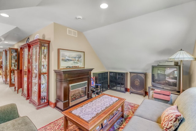 53245 Sunrise Ln, Park Rapids, MN 56470 - carpeted living area featuring lofted ceiling, a glass covered fireplace, and recessed lighting