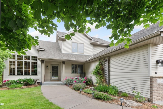 9534 Kirkwood Way N, Maple Grove, MN 55369 - view of front of property featuring a shingled roof and a front yard
