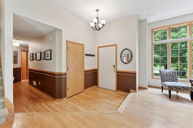 9534 Kirkwood Way N, Maple Grove, MN 55369 - entryway with light wood-style flooring and a chandelier