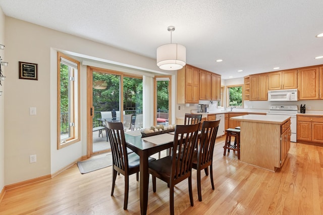 9534 Kirkwood Way N, Maple Grove, MN 55369 - dining space with light wood-style flooring, recessed lighting, and a textured ceiling