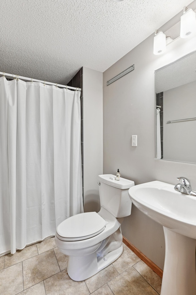 9534 Kirkwood Way N, Maple Grove, MN 55369 - full bath with a textured ceiling, tile patterned flooring, and curtained shower