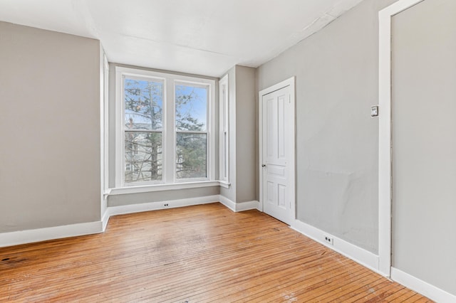 65 George St E, Saint Paul, MN 55107 - spare room with light wood-style floors and baseboards