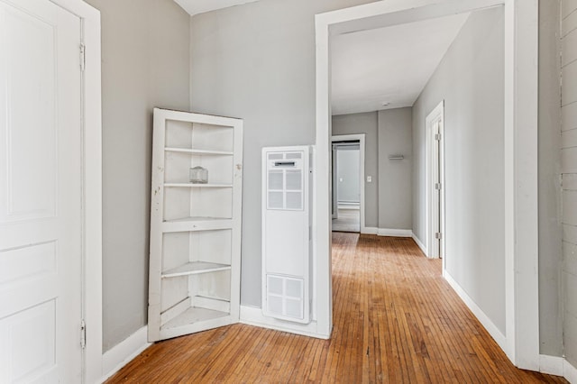 65 George St E, Saint Paul, MN 55107 - hallway featuring a heating unit and hardwood / wood-style flooring