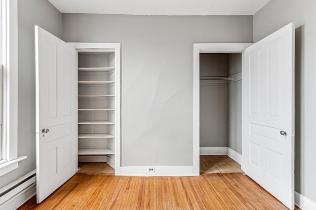 65 George St E, Saint Paul, MN 55107 - closet with a baseboard heating unit