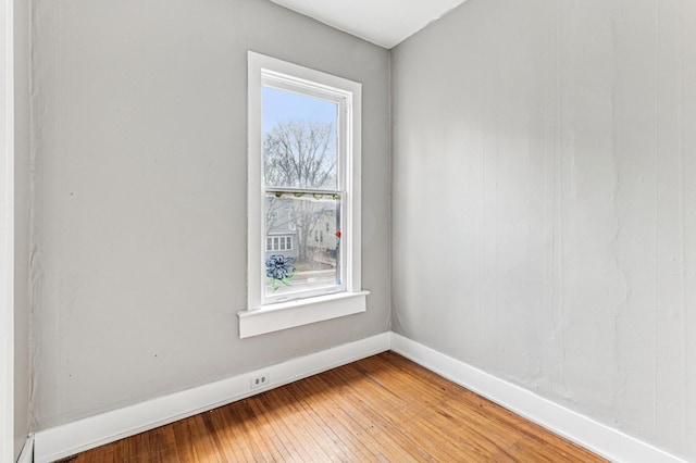 65 George St E, Saint Paul, MN 55107 - spare room featuring baseboards and light wood-type flooring