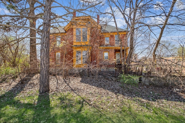 65 George St E, Saint Paul, MN 55107 - rear view of house featuring a chimney