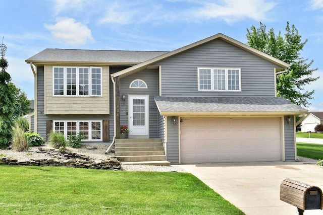 404 3rd Way SE, Dover, MN 55929 - bi-level home with a garage, concrete driveway, a front lawn, and a shingled roof