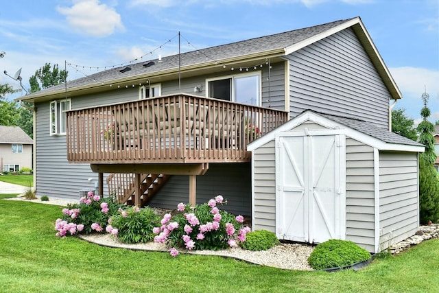 404 3rd Way SE, Dover, MN 55929 - rear view of property with a wooden deck, a lawn, a shed, and roof with shingles