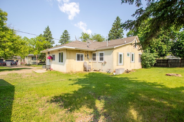 724 10th St NW, Bemidji, MN 56601 - rear view of house with stucco siding