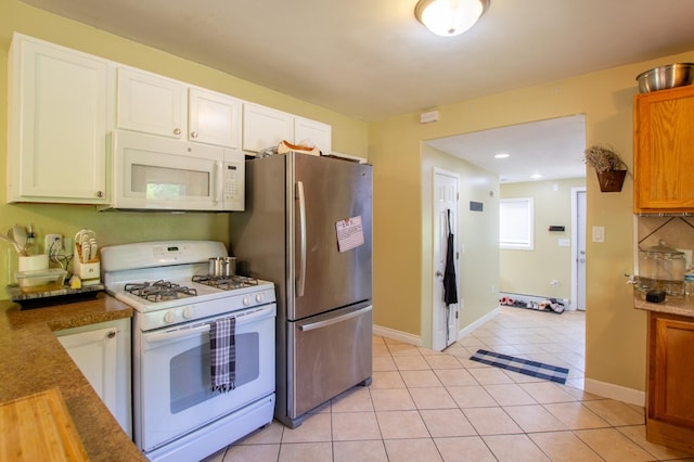 724 10th St NW, Bemidji, MN 56601 - kitchen with white appliances, light tile patterned floors, white cabinetry, and recessed lighting