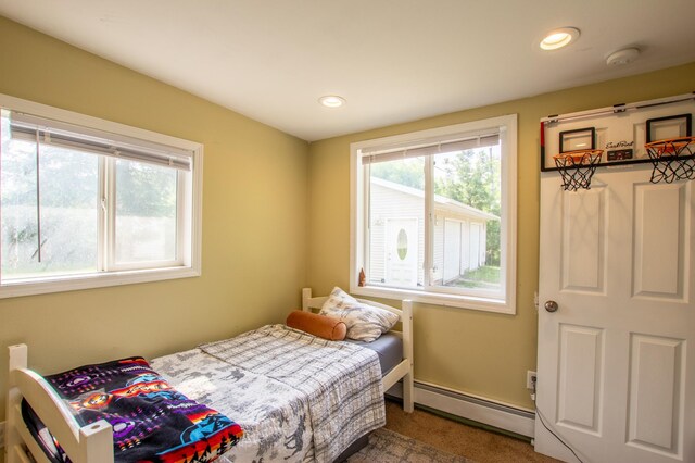 724 10th St NW, Bemidji, MN 56601 - carpeted bedroom with a baseboard radiator and recessed lighting