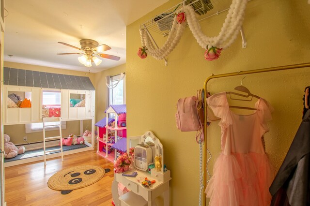 724 10th St NW, Bemidji, MN 56601 - recreation room with wood finished floors and a ceiling fan