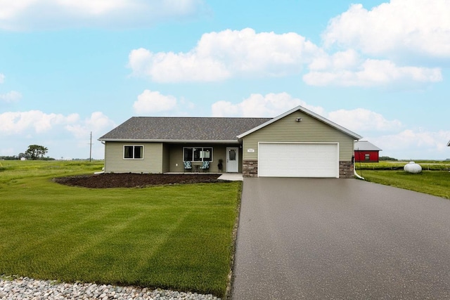 713 Prairie Wind Ave, Callaway, MN 56521 - ranch-style home featuring asphalt driveway, a front yard, an attached garage, and a porch