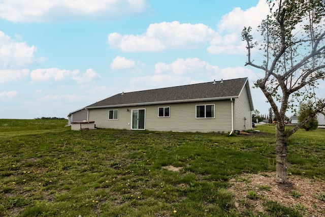 713 Prairie Wind Ave, Callaway, MN 56521 - rear view of property with a yard and roof with shingles