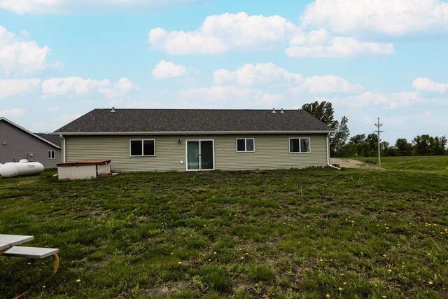 713 Prairie Wind Ave, Callaway, MN 56521 - rear view of house with a yard and a covered hot tub