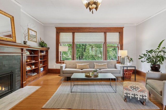 436 Holly Ave Unit 3, Saint Paul, MN 55102 - living area featuring wood finished floors, ornamental molding, and a brick fireplace