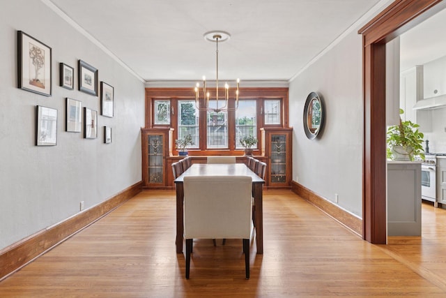 436 Holly Ave Unit 3, Saint Paul, MN 55102 - dining room with a chandelier, light wood-style floors, and ornamental molding