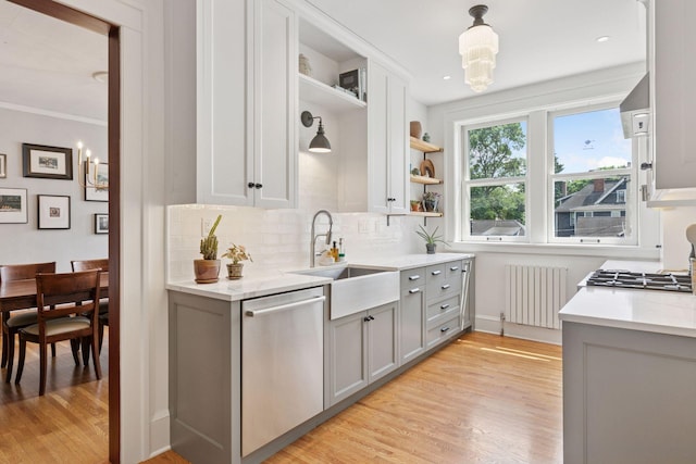 436 Holly Ave Unit 3, Saint Paul, MN 55102 - kitchen featuring radiator, dishwasher, open shelves, gray cabinetry, and light wood-style flooring