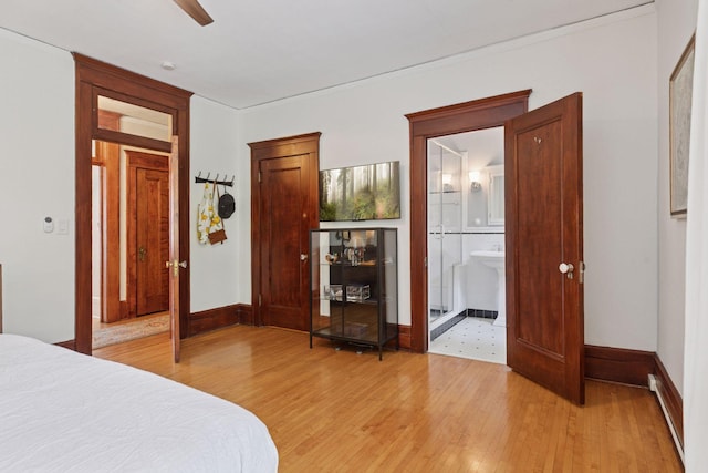 436 Holly Ave Unit 3, Saint Paul, MN 55102 - bedroom featuring light wood finished floors and ensuite bath
