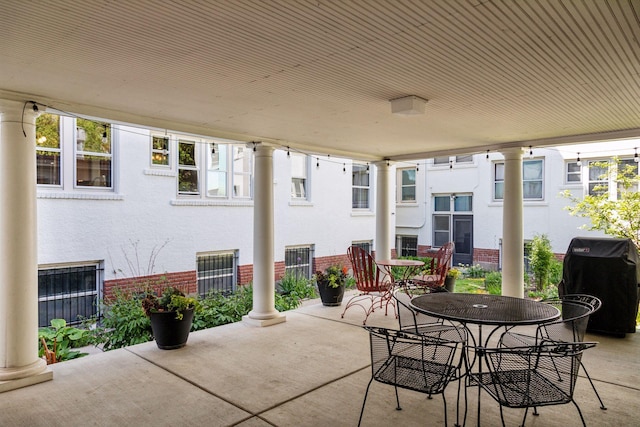 436 Holly Ave Unit 3, Saint Paul, MN 55102 - view of patio featuring a grill and outdoor dining area