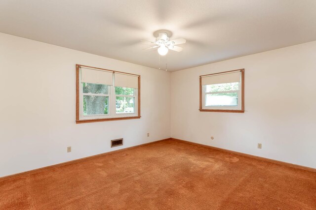 419 Jackson St, Saint Peter, MN 56082 - carpeted spare room with a ceiling fan and baseboards