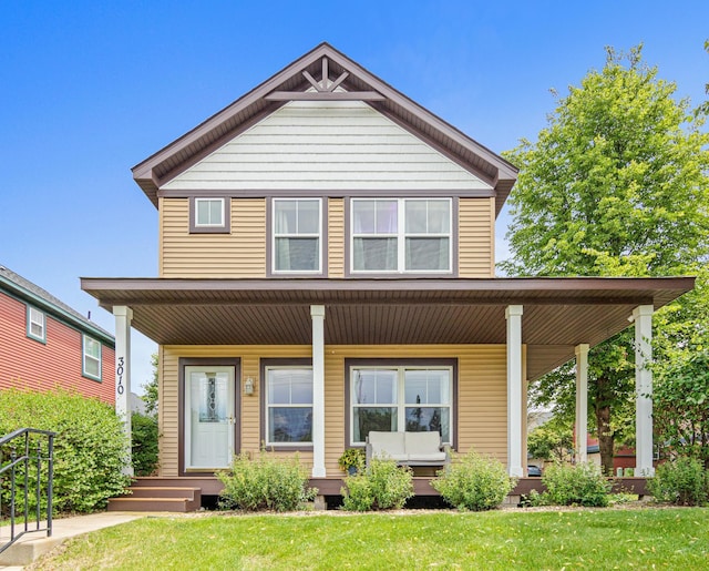 3010 Hazelwood St, Maplewood, MN 55109 - view of front of property with a porch and a front yard