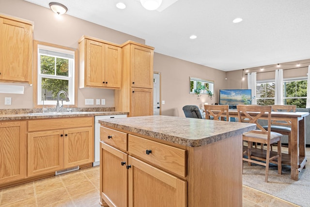 3010 Hazelwood St, Maplewood, MN 55109 - kitchen featuring light brown cabinetry, white dishwasher, plenty of natural light, and recessed lighting