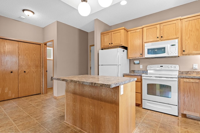 3010 Hazelwood St, Maplewood, MN 55109 - kitchen with white appliances, light brown cabinetry, a center island, and light countertops