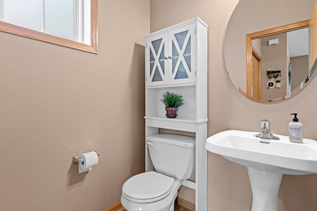 3010 Hazelwood St, Maplewood, MN 55109 - half bathroom with toilet and a sink