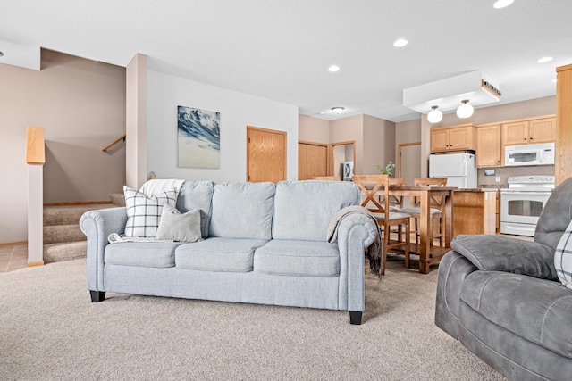 3010 Hazelwood St, Maplewood, MN 55109 - living room with light colored carpet, recessed lighting, and stairs
